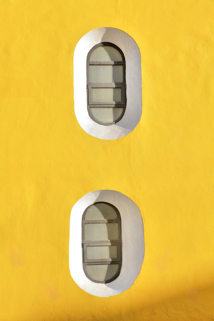Johny Vino abstract photograph of yellow porthole windows