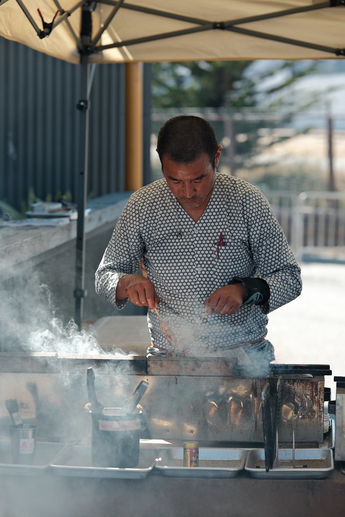 Johny Vino action photograph of a chef cooking at an outdoor station