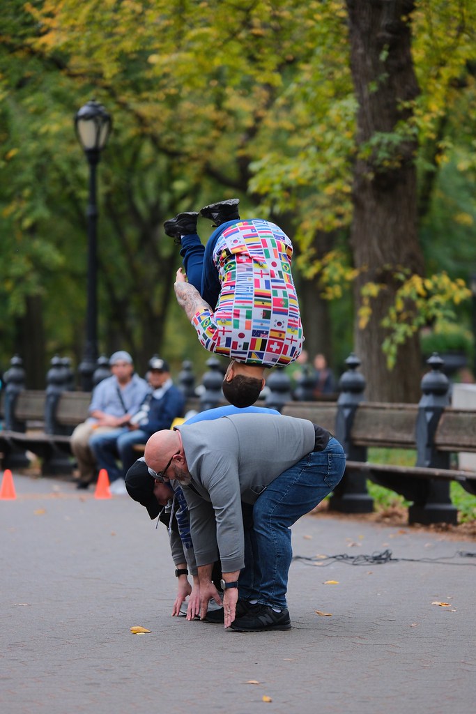 Johny Vino action photograph of a skateboard trick in a park