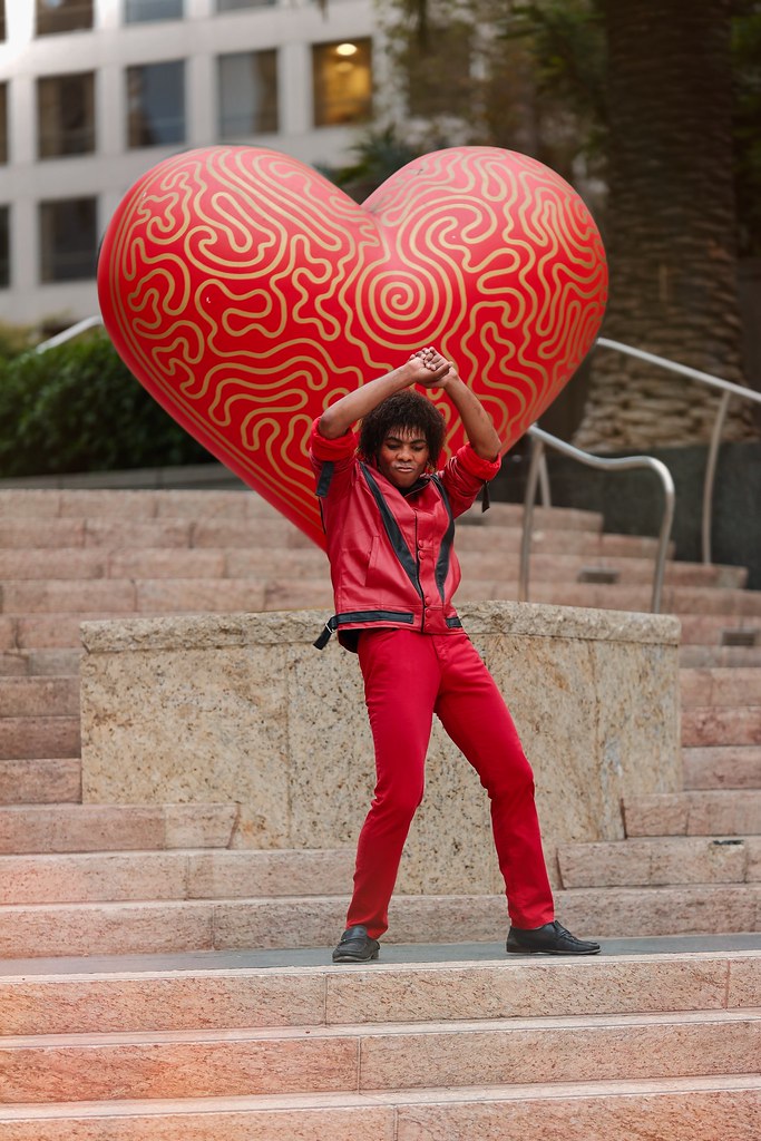 Johny Vino portrait photograph with a red heart balloon in the city