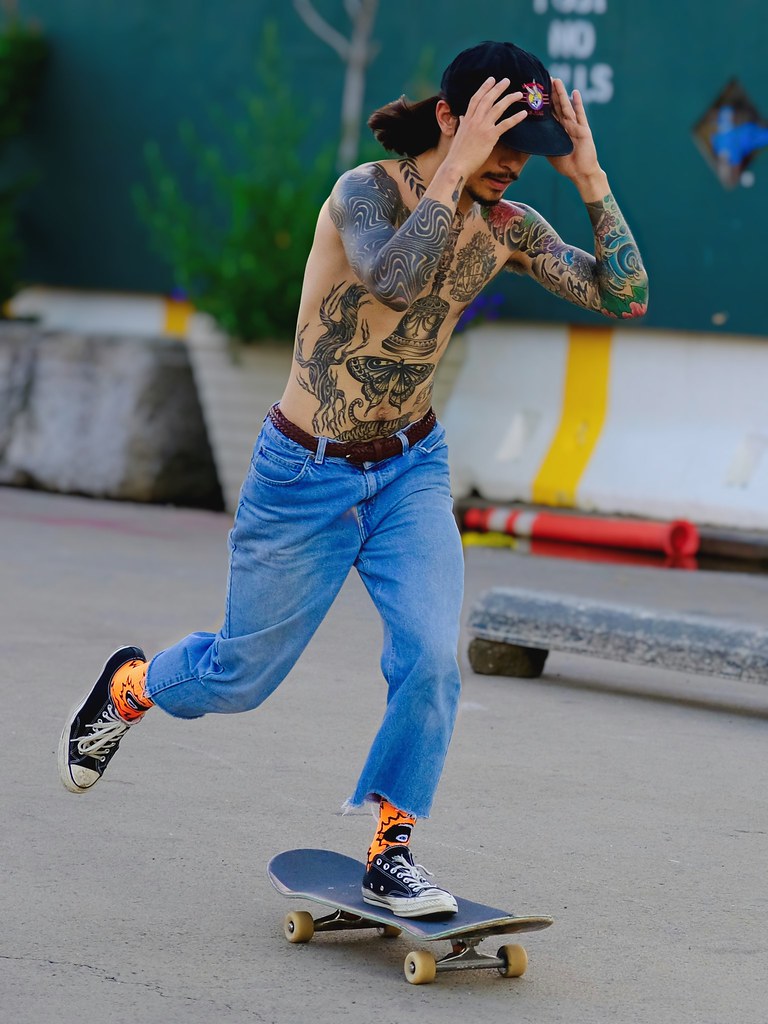 Johny Vino portrait photograph of a skateboarder in street action