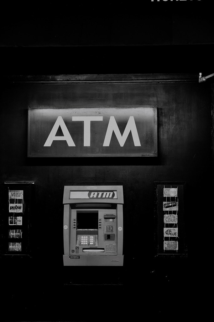 Johny Vino black and white still life photograph of an ATM sign