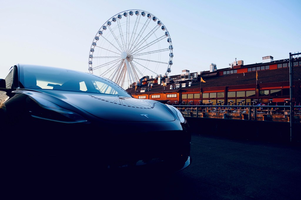 Johny Vino still life photograph of a car and Ferris wheel street scene