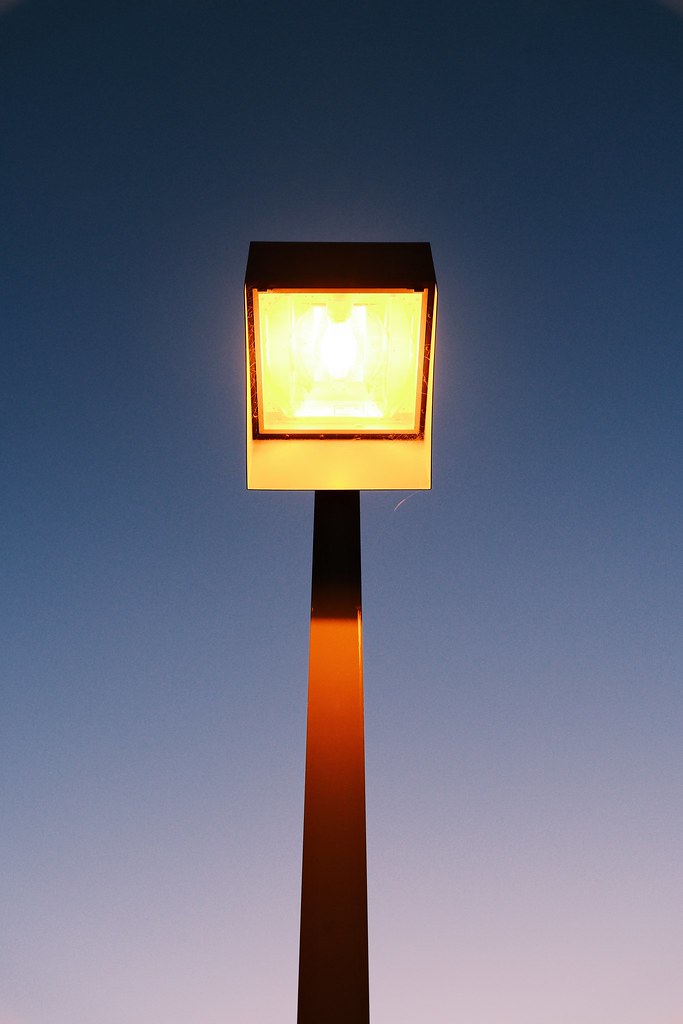 Johny Vino still life photograph of a glowing street lamp at twilight